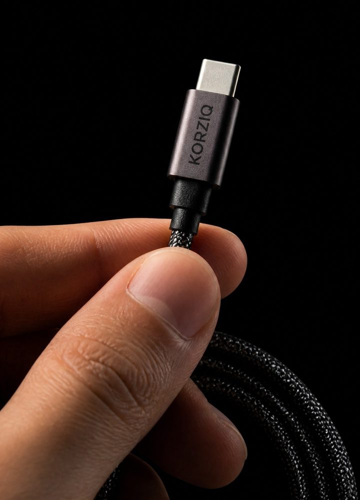KORZIQ USB-C connector held between two fingers